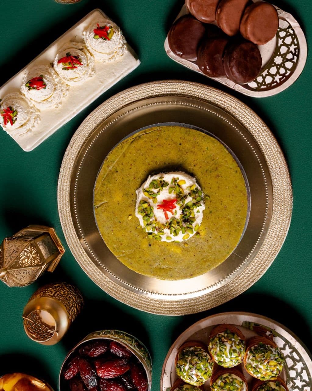Spread of traditional Lebanese desserts including Bachir Daoukieh cake, Mafroukeh, and Ashta treats